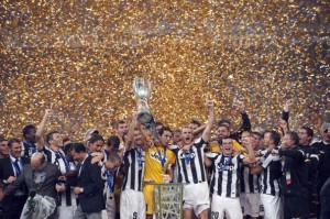 Juventus players celebrate with the trop